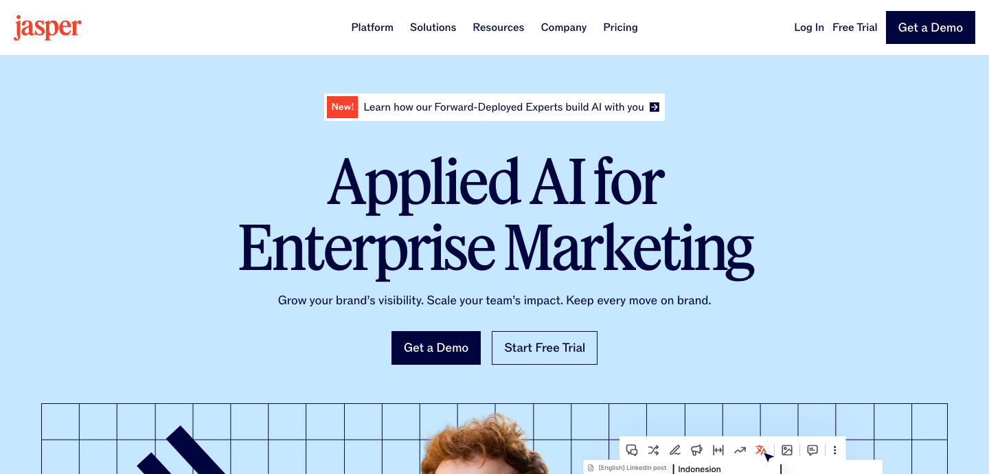 Jasper homepage headline Applied AI for Enterprise Marketing with Get a Demo and Start Free Trial buttons.